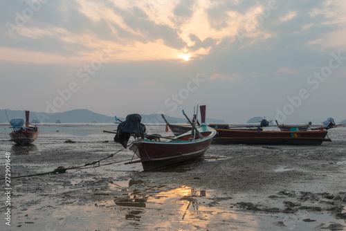boat on the beach at sunset © Sanya