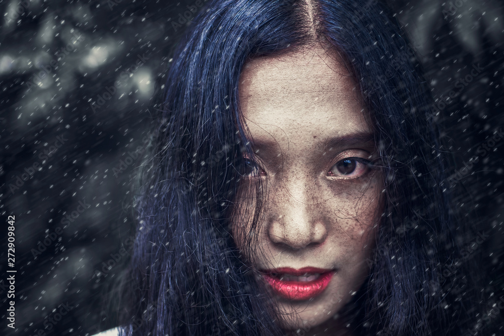Close-up photos of a woman face with freckles The eyes look uncompromising. Close-up photos of a woman face with freckles The eyes look uncompromising.