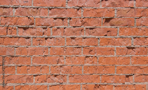 Red brick wall in daylight