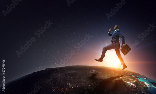 Running black businessman with briefcase © Sergey Nivens