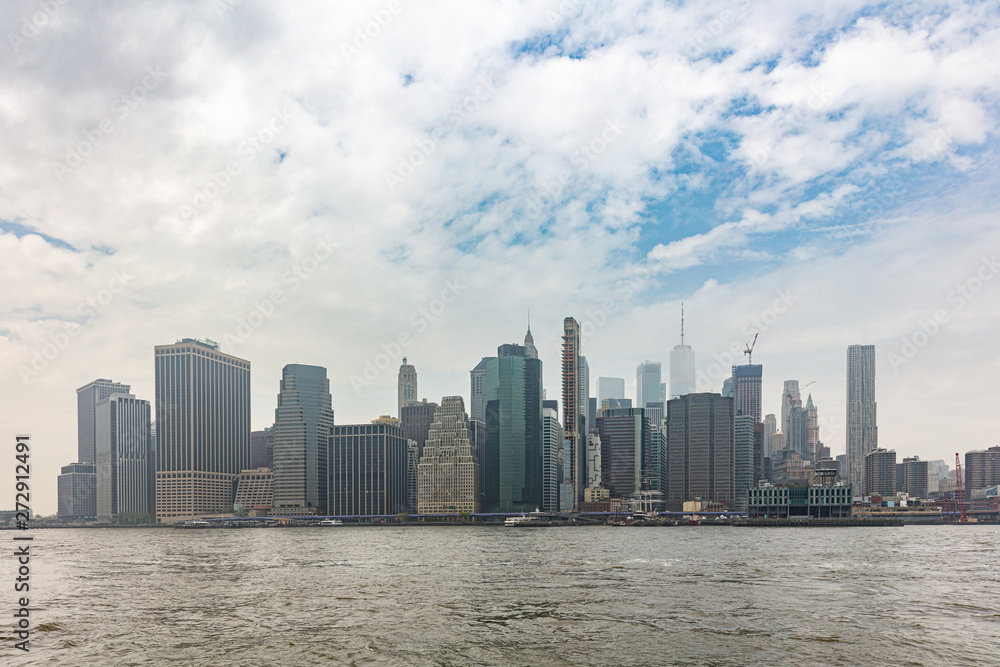 Manhattan skyscrapers, New York city skyline, cloudy spring day