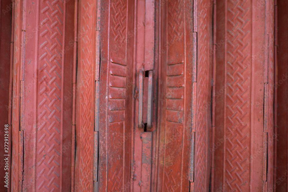 Fototapeta premium A detail of the metal folding door of the entrance