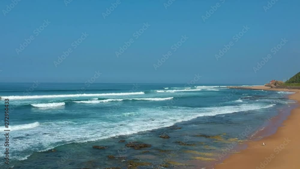 Flying drone over the Beach/Sea shoreline above the sea and sand at Durban South Africa Flying drone over the Beach/Sea shoreline above the sea and sand at Durban South Africa