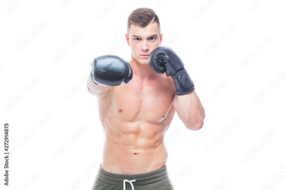 Muscular young man in black boxing gloves and shorts shows the different movements and strikes in the studio on a white background. Strong Athletic Man - Fitness Model showing his perfect body. Copy Muscular young man in black boxing gloves and shorts shows the different movements and strikes in the studio on a white background. Strong Athletic Man - Fitness Model showing his perfect body. Copy