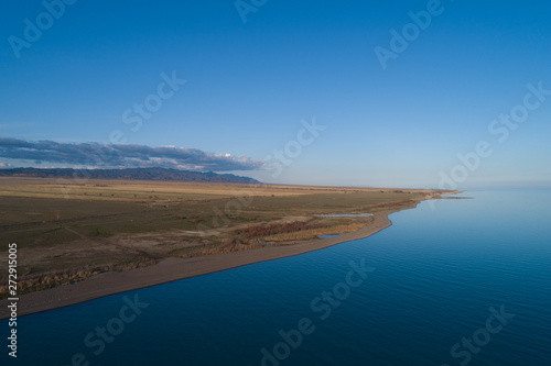 aerial view of the shoreline of the lake © Alexandr Vlassyuk
