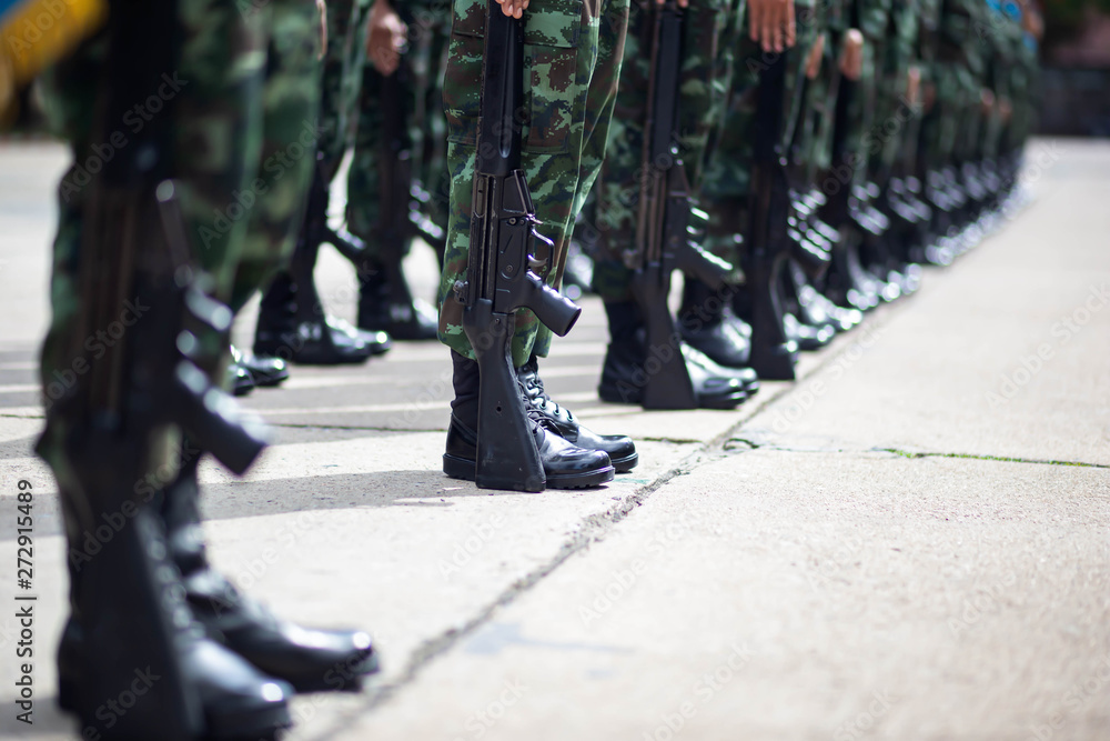 Naklejka premium The Army soldier stand in row they are wear hat and wear Military vest.