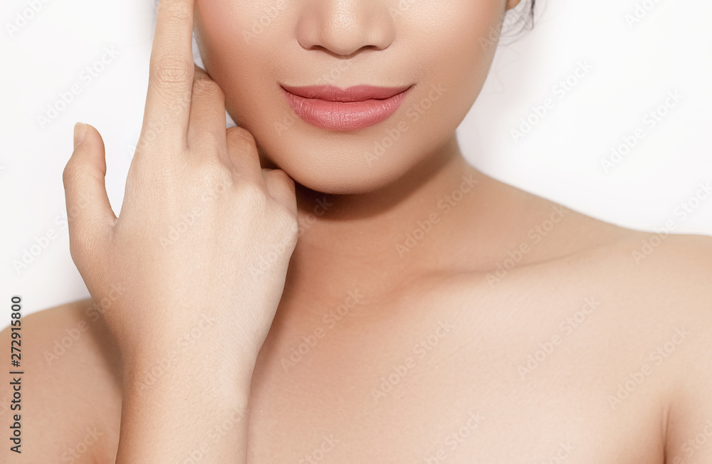 beautiful woman's face From nose to chest Showing bright pink lips And clean, healthy natural skin cleared, under the concept of beauty And skin care beautiful woman's face From nose to chest Showing bright pink lips And clean, healthy natural skin cleared, under the concept of beauty And skin care