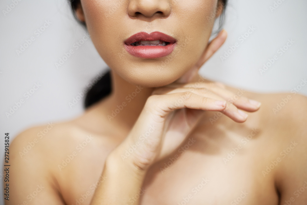 beautiful woman's face From nose to chest Showing bright pink lips And clean, healthy natural skin cleared, under the concept of beauty And skin care beautiful woman's face From nose to chest Showing bright pink lips And clean, healthy natural skin cleared, under the concept of beauty And skin care