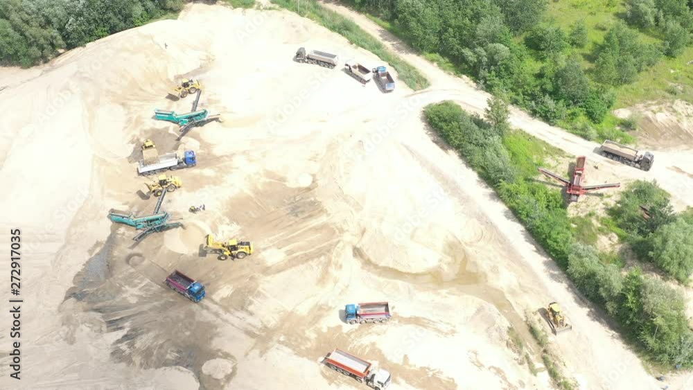 Mining conveyor at sand quarry. Aerial view of mining machinery. Mining industry Mining conveyor at sand quarry. Aerial view of mining machinery. Mining industry