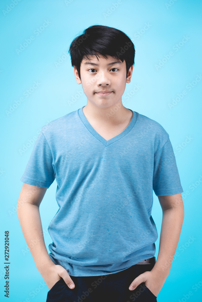 Portrait of look good asian kid on blue background. Portrait of look good asian kid on blue background.