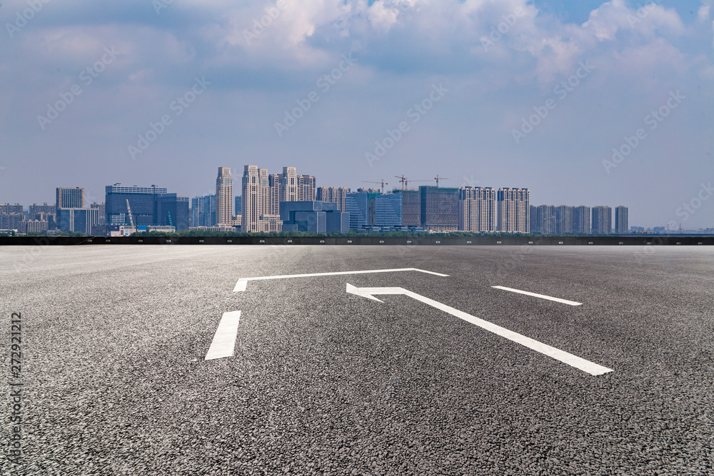 Fototapeta premium Panoramic skyline and modern business office buildings with empty road,empty concrete square floor