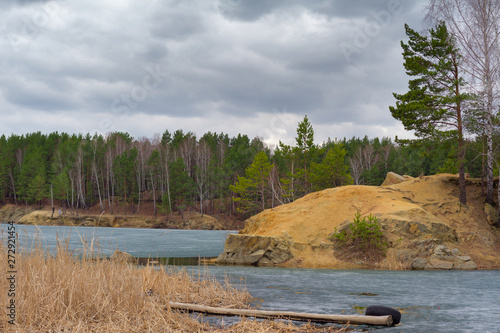 Granite sandy cape and frozen pond. Chelyabinsk, Blue Quarry photo