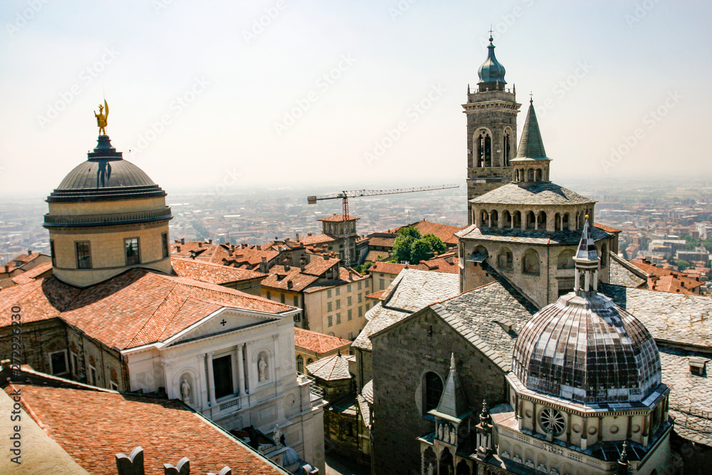 View of the Basilica of Santa Maria Maggiore, Cappella Colleoni (Colleoni Chapel) and the Duomo di Bergamo (Cathedral) in Citta Alta of Bergamo,  Italy. May 2012 