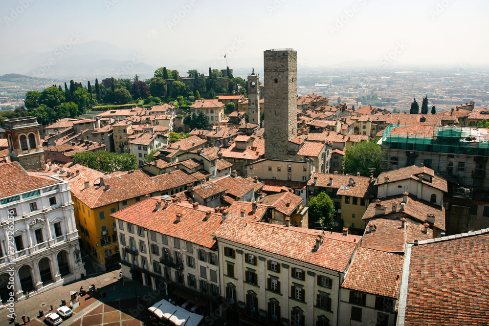 Bergamo, view over the red tile roofs and towers of medieval historical Old Town, Lombardy, Italy. May 2012