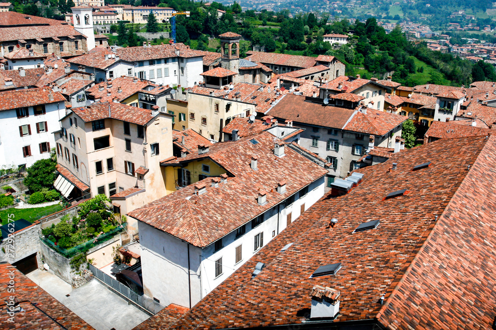 Bergamo, view over the red tile roofs and towers of medieval historical Old Town, Lombardy, Italy. May 2012