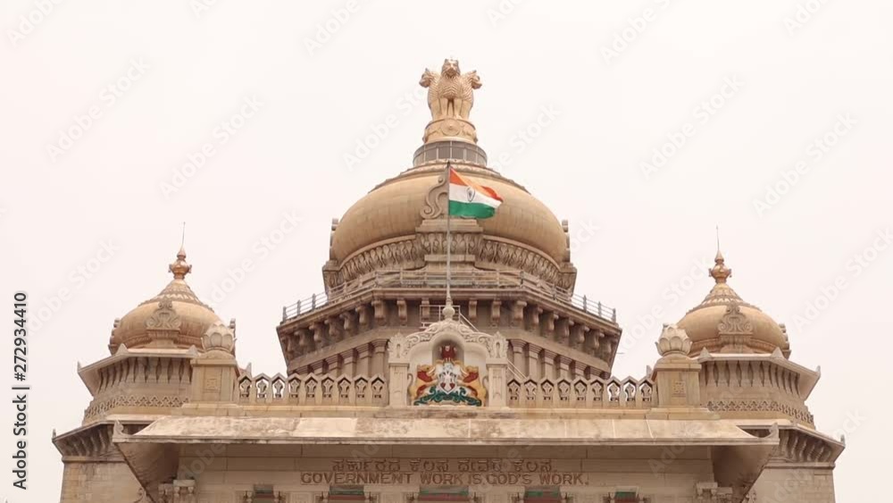 Waving Indian flag above the Vidhana Soudha or parliament or legislative assembly of Karnataka at Bangalore, India. Waving Indian flag above the Vidhana Soudha or parliament or legislative assembly of Karnataka at Bangalore, India.