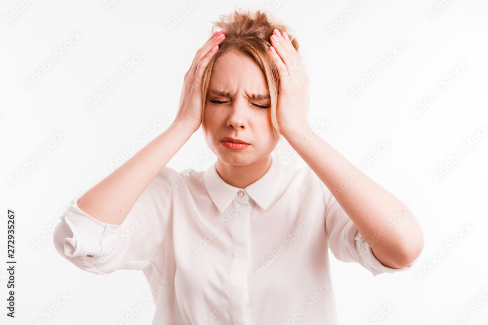 Frustrated girl suffering from head ache. Upset young woman with pain grimace holding head. Headache or loss concept Frustrated girl suffering from head ache. Upset young woman with pain grimace holding head. Headache or loss concept