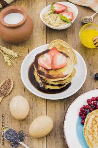 Breakfast with pancakes and strawberries