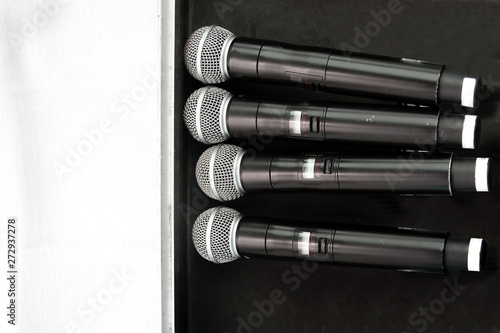 4 microphones on black background