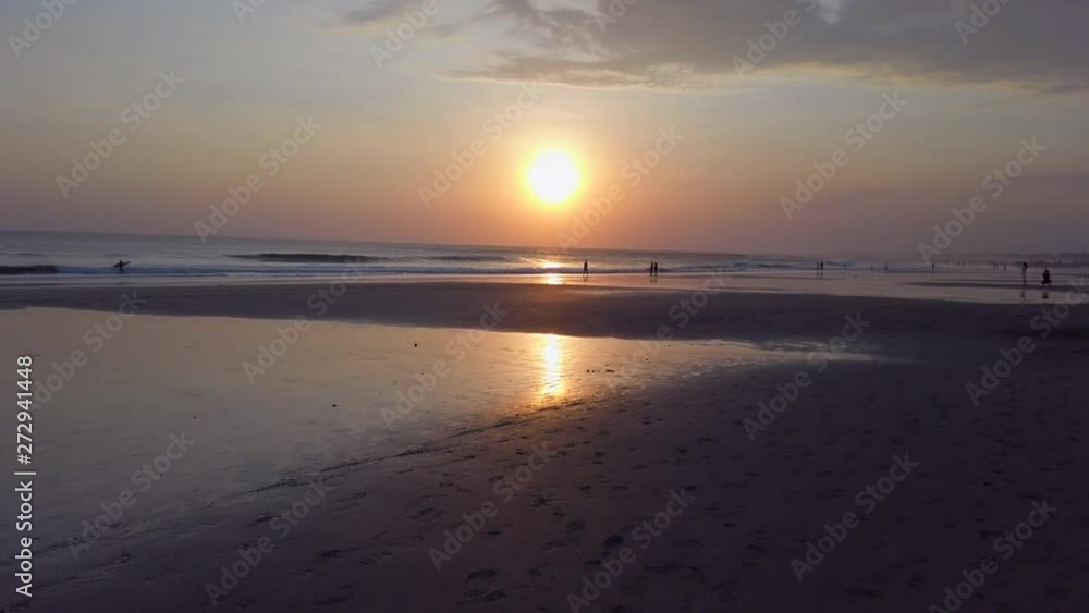 walking on beach in Bali, beautiful sunset view with silhouettes of people walking down the coastline.
Indonesia holiday vacation walking on beach in Bali, beautiful sunset view with silhouettes of people walking down the coastline.
Indonesia holiday vacation