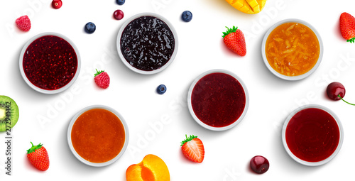 Berry and fruit jams isolated on white background, top view photo
