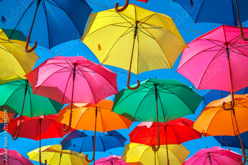 Colorful umbrellas in the sky as background. Street decoration. 