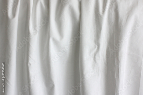 White fabric with folds close up photo. Mock up ready for your pattern.