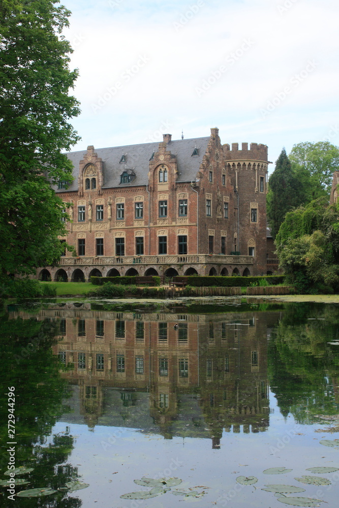 Old moated castle with reflexion