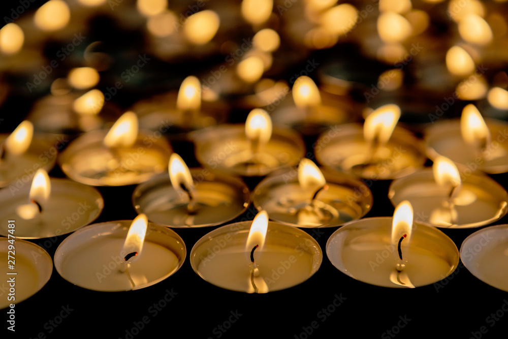 Many small burning candles