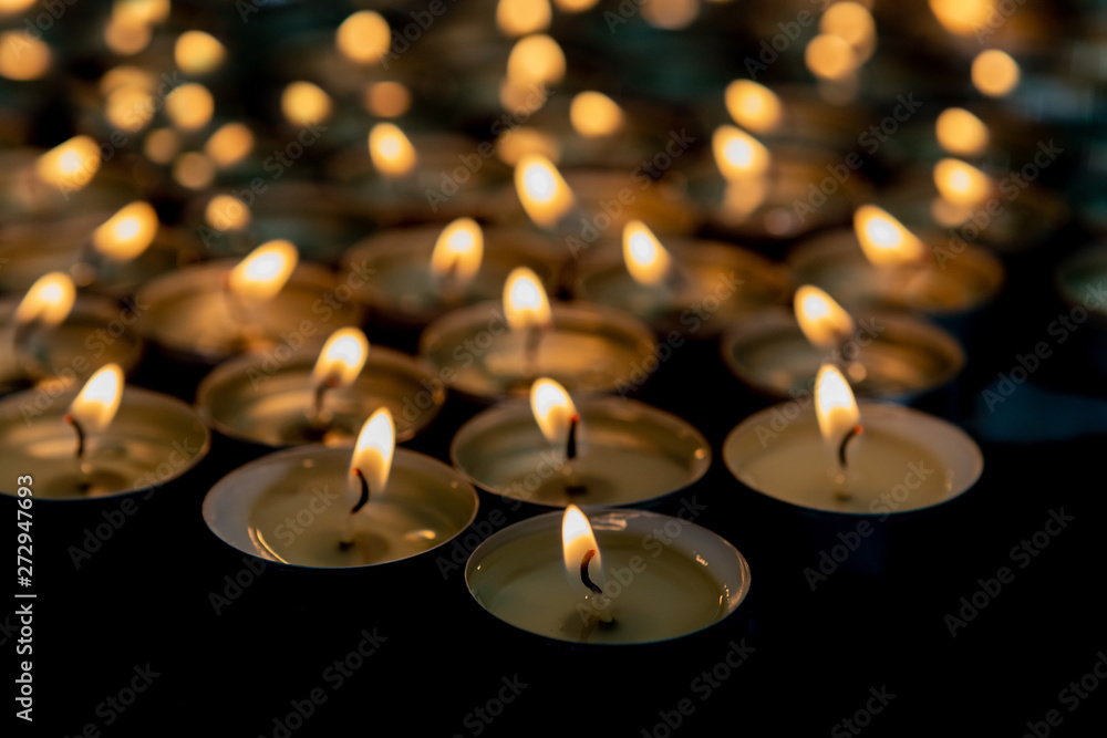 Many small burning candles