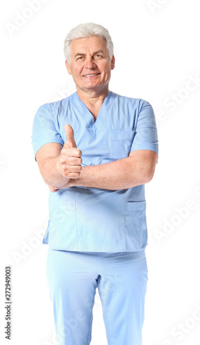 Portrait of mature physiotherapist showing thumb-up gesture on white background