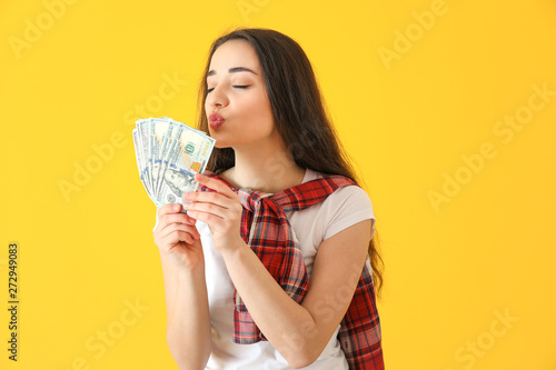 Happy young woman with doll...