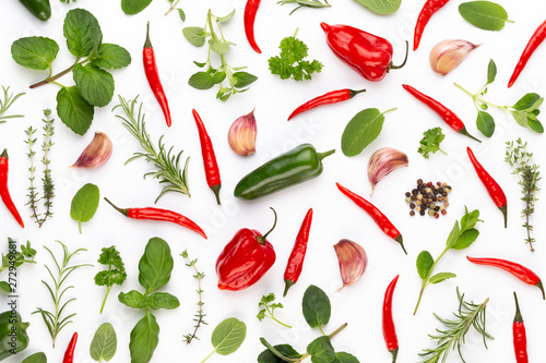 Spice herbal leaves and chili pepper on white background. Vegetables pattern. Floral and vegetables on white background. Top view, flat lay.