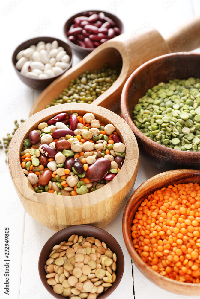 Assortment of legumes on white table Assortment of legumes on white table