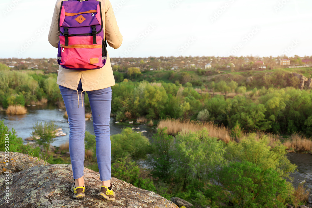 Female tourist in mountains on spring day Female tourist in mountains on spring day
