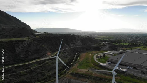 Windmill Farm wind park wind turbines Sunset Colors Farmland Field Wasatch Mountain Range Blue Skys Agriculture Farming Spanish Fork Utah Renewable Energy Cinematic Video USA 4K photo