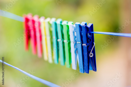 Clothes pegs hanging on clothesline