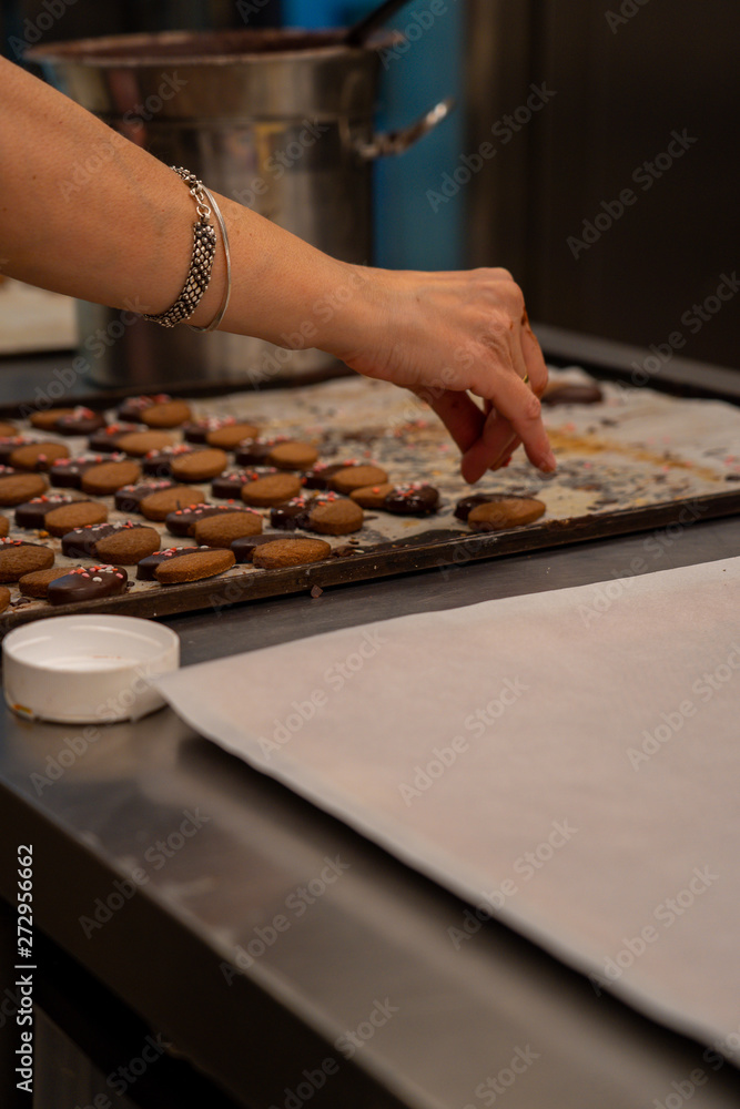 Fototapeta premium Detail of tea pasta, with chocolate and decoration of colored sugar hearts.