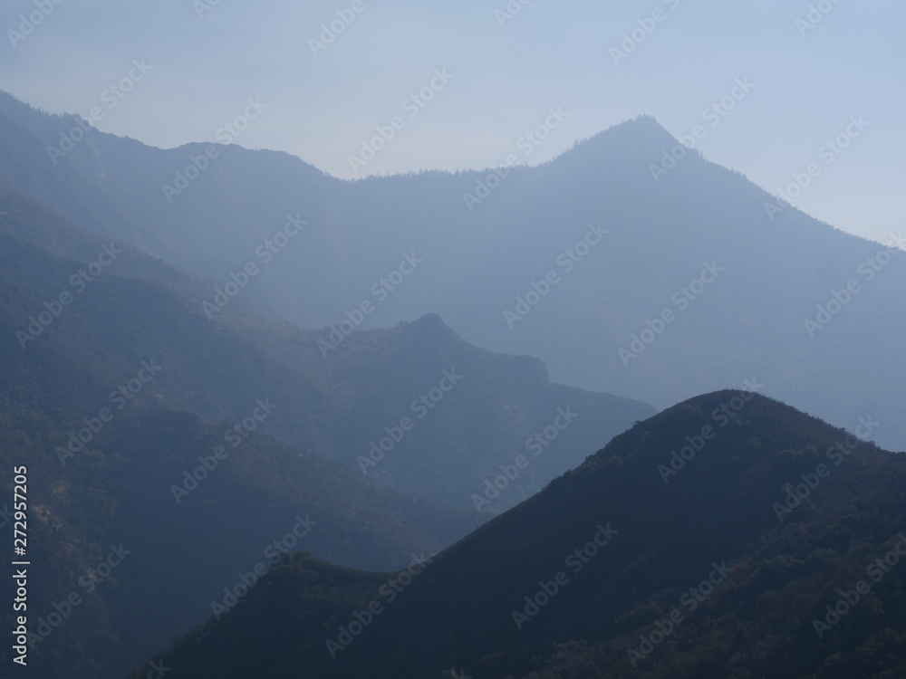Moody atmospheric landscape of mountain peaks