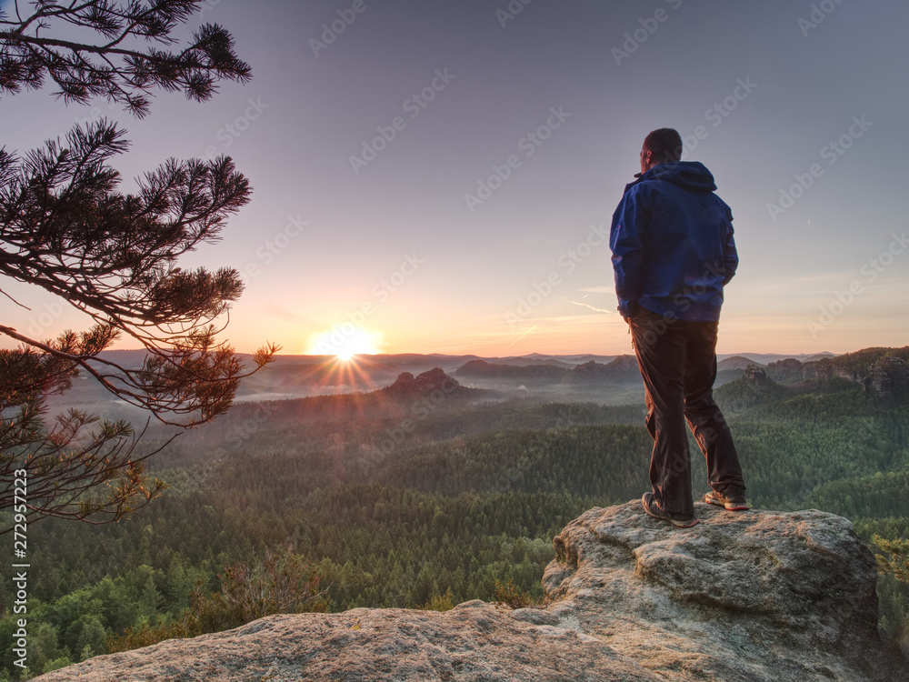 Tall man in sports clothes enjoy morning in pure nature