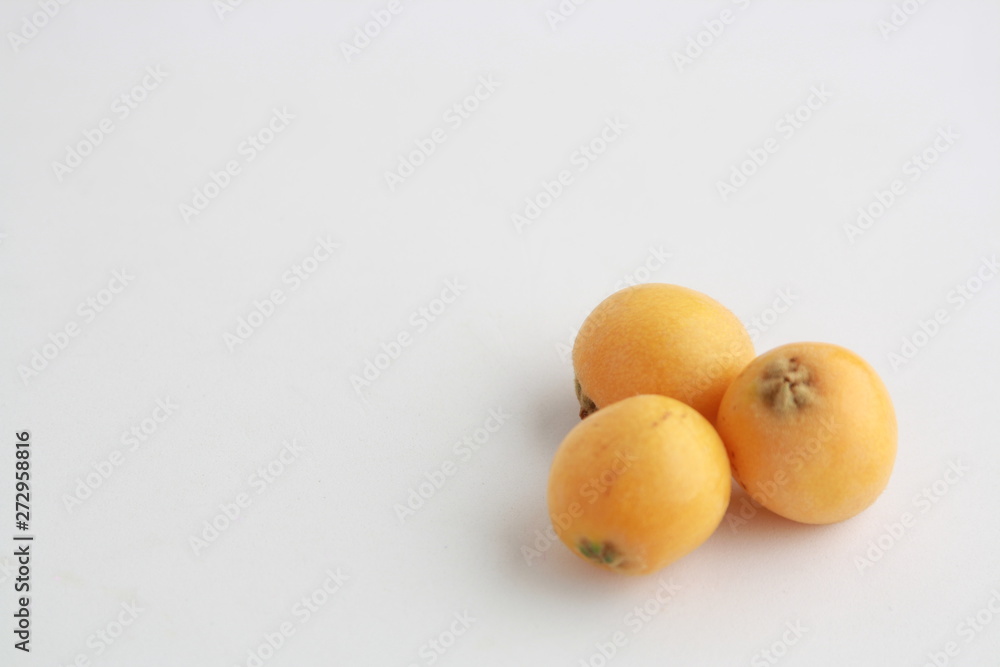 delicious yellow medlar fruit with white background delicious yellow medlar fruit with white background