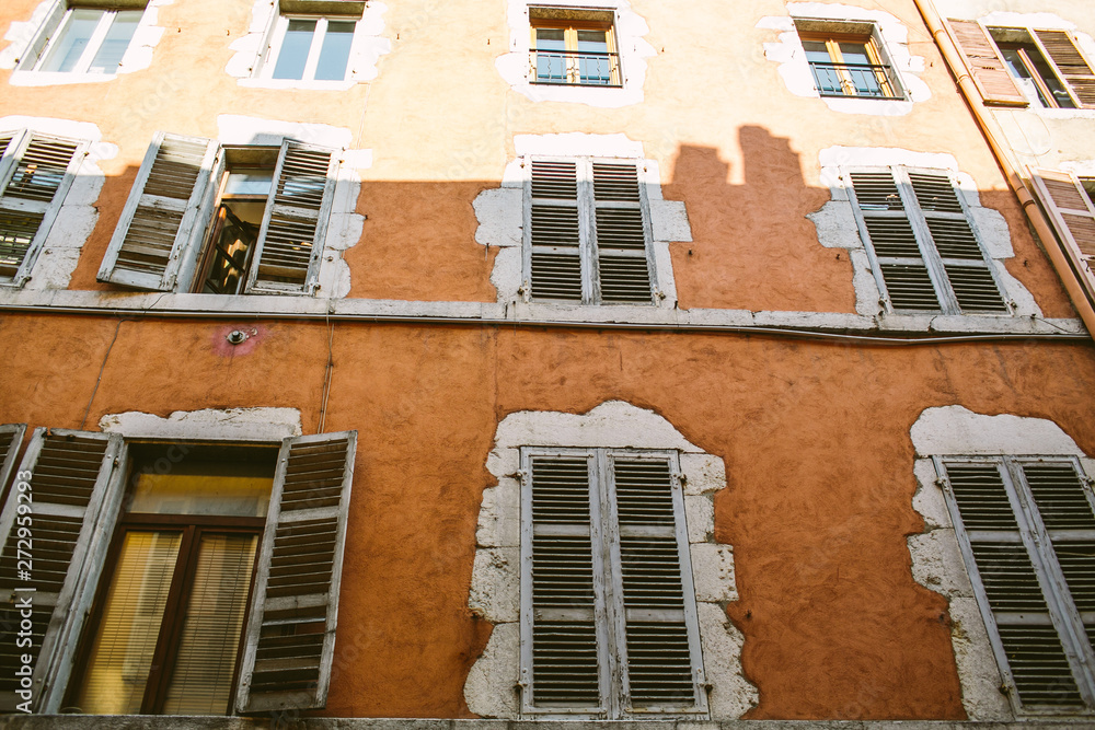 Obraz premium Old city scene: windows with vintage wooden shutters