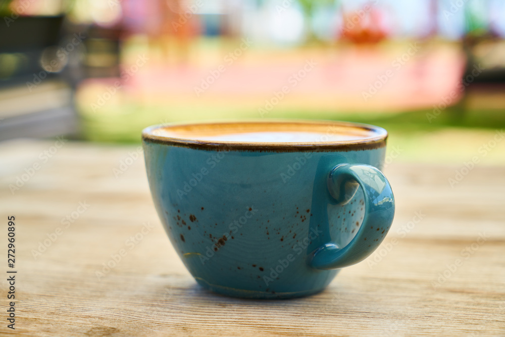 Delicious latte coffee on the wooden table Delicious latte coffee on the wooden table