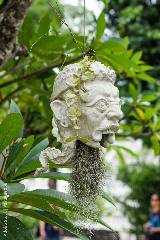 Scary masks hanging on trees at Wat Rong Khun - The White Temple Scary masks hanging on trees at Wat Rong Khun - The White Temple