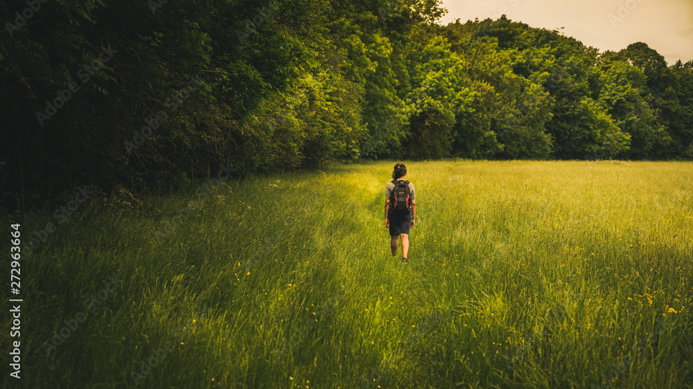 A woman waking in the countryside A woman waking in the countryside