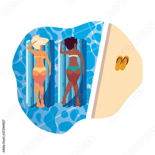 beautiful interracial girls with float mattress in water
