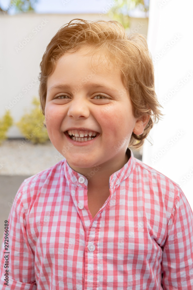 Happy child with pink shirt in the garden Happy child with pink shirt in the garden
