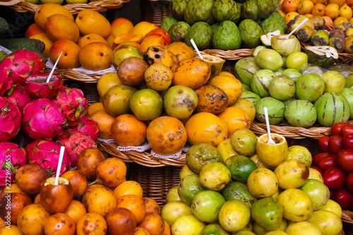 Fototapeta Naklejka Na Ścianę i Meble -  Passion fruit, dragon fruit and annona on Funchail market