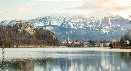BLED, SLOVENIA - MARCH 20, 2019: Colourful spring scene on the Bled lake with medieval castle Blejski grad. Morning in Julian Slovenia, Europe.