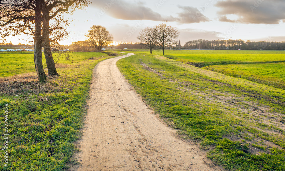 Winding sand path in backlit